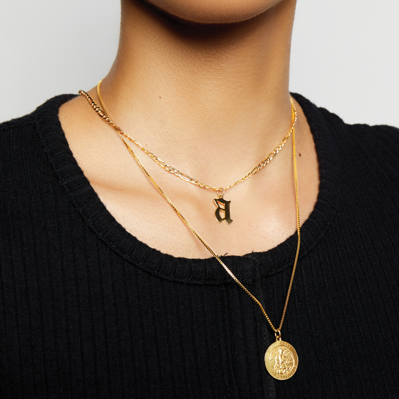 lowercase old english necklace on the model